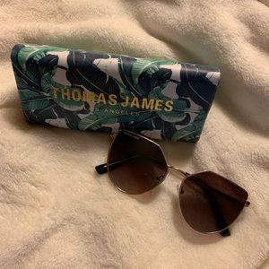 Cute Thomas James sunglasses with case.